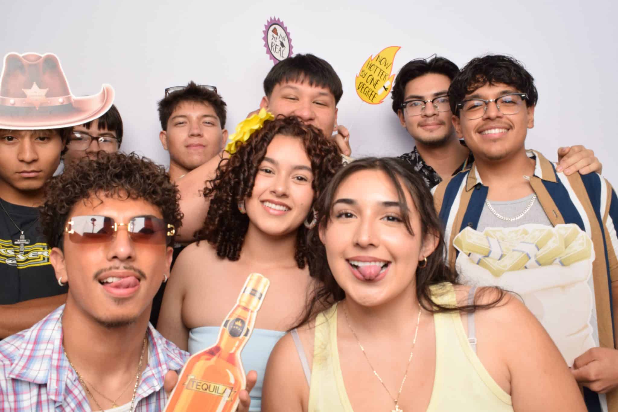 Guests sharing a 29PM photo booth moment