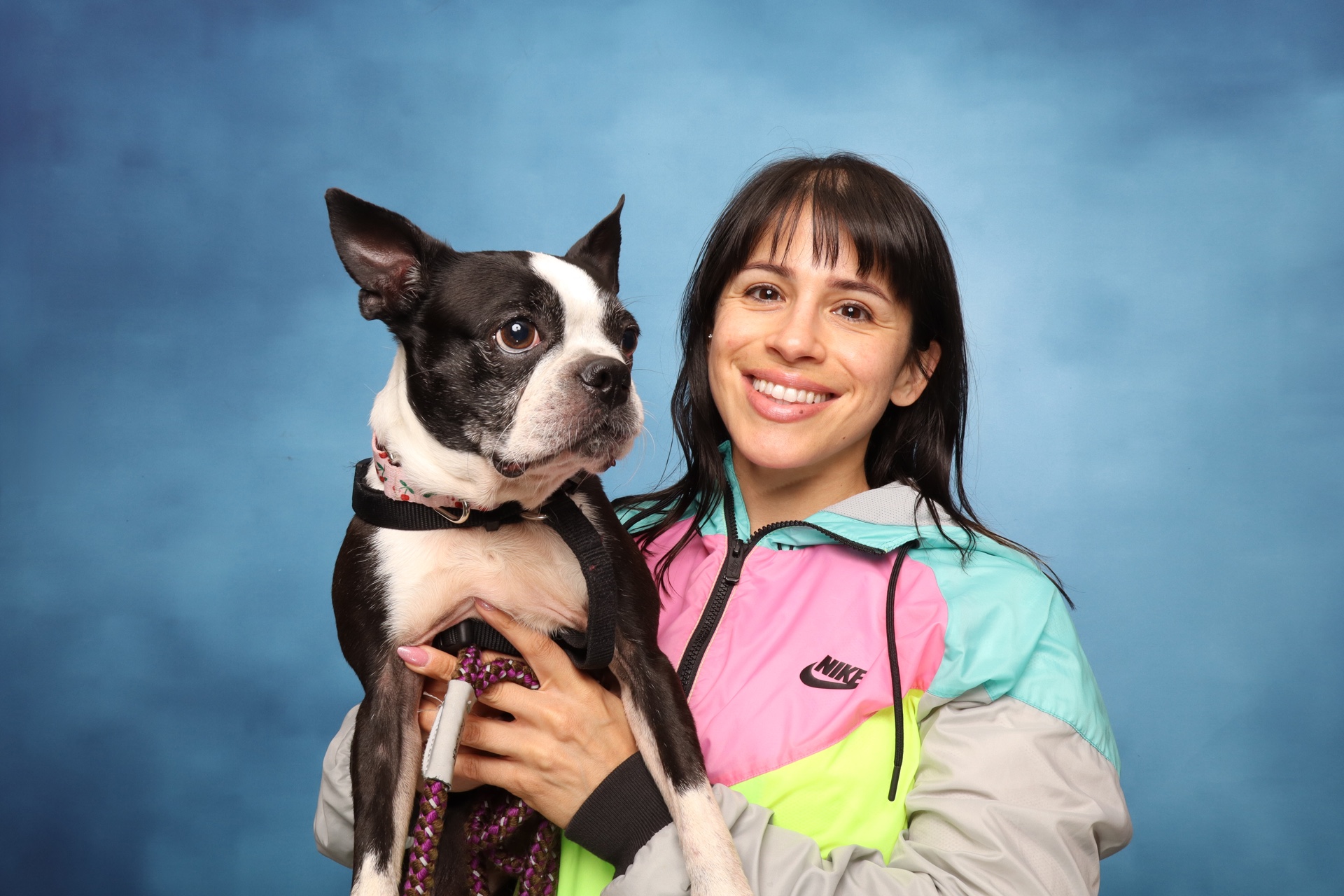Original photo booth portrait of a woman holding her dog